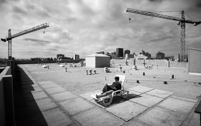 Person reading on a rooftop