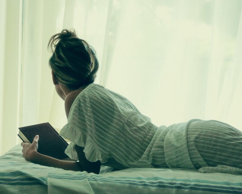 Person Reading on Bed