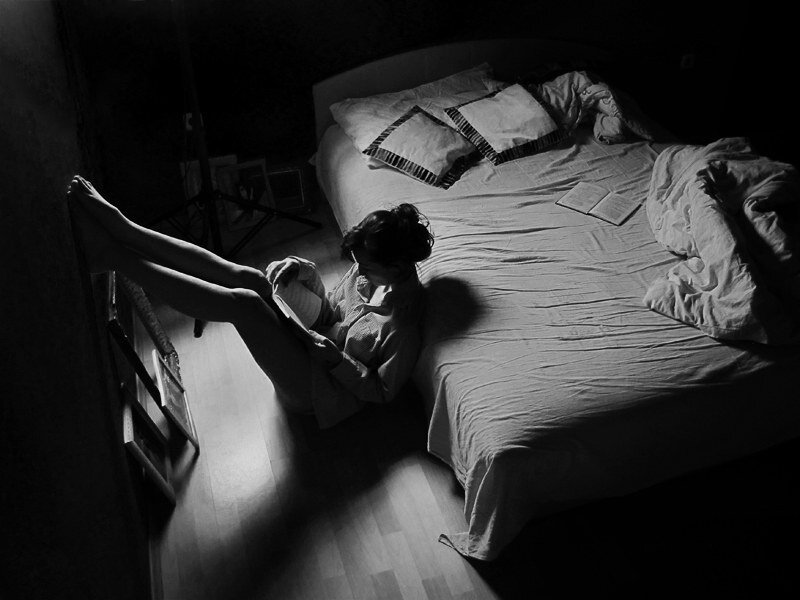Person Reading on Floor — Black