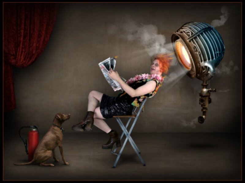 person reading under spotlight