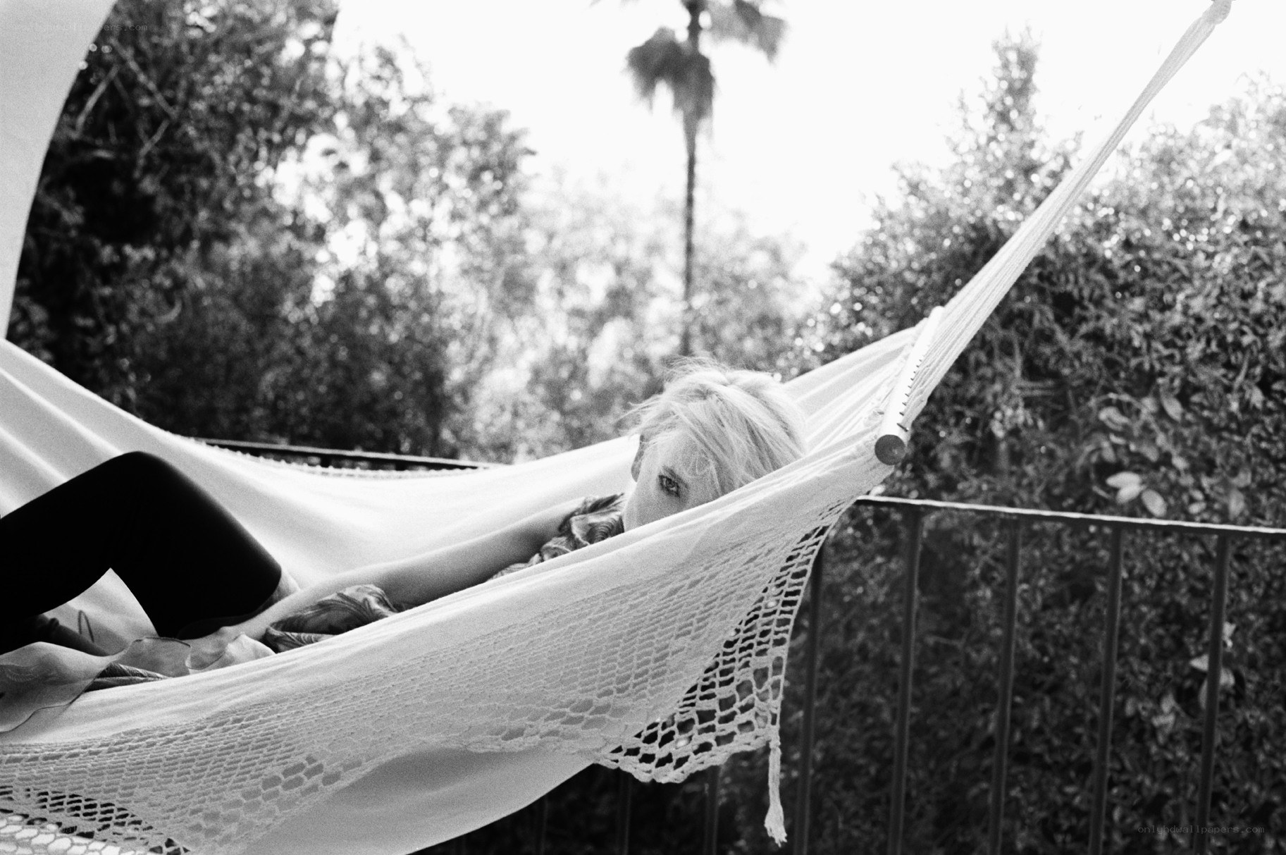 person relaxing in a hammock