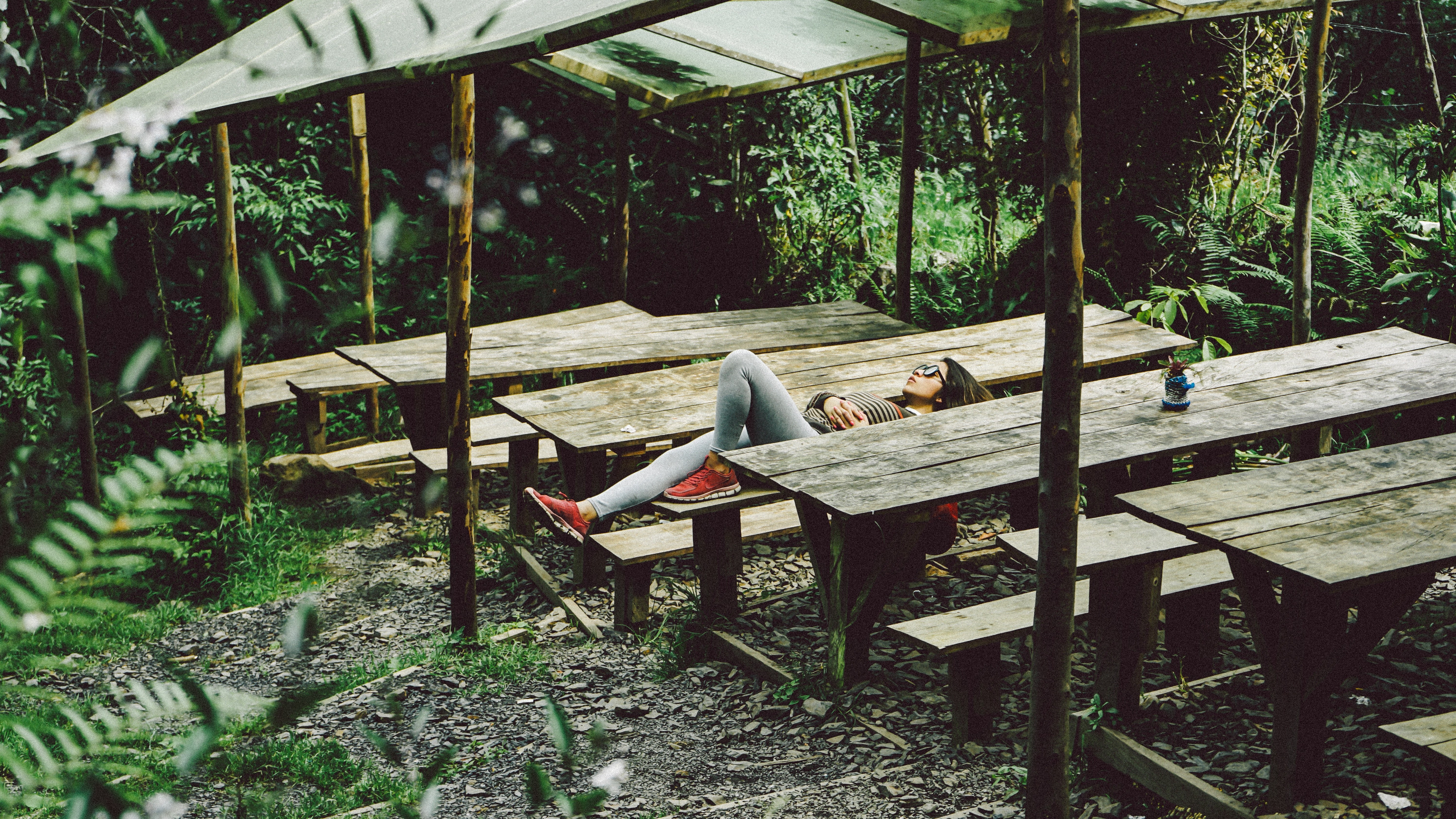 Person resting at picnic table