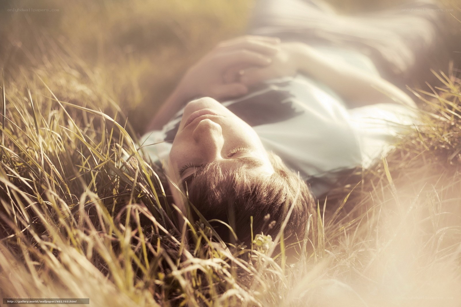 Person resting in grass