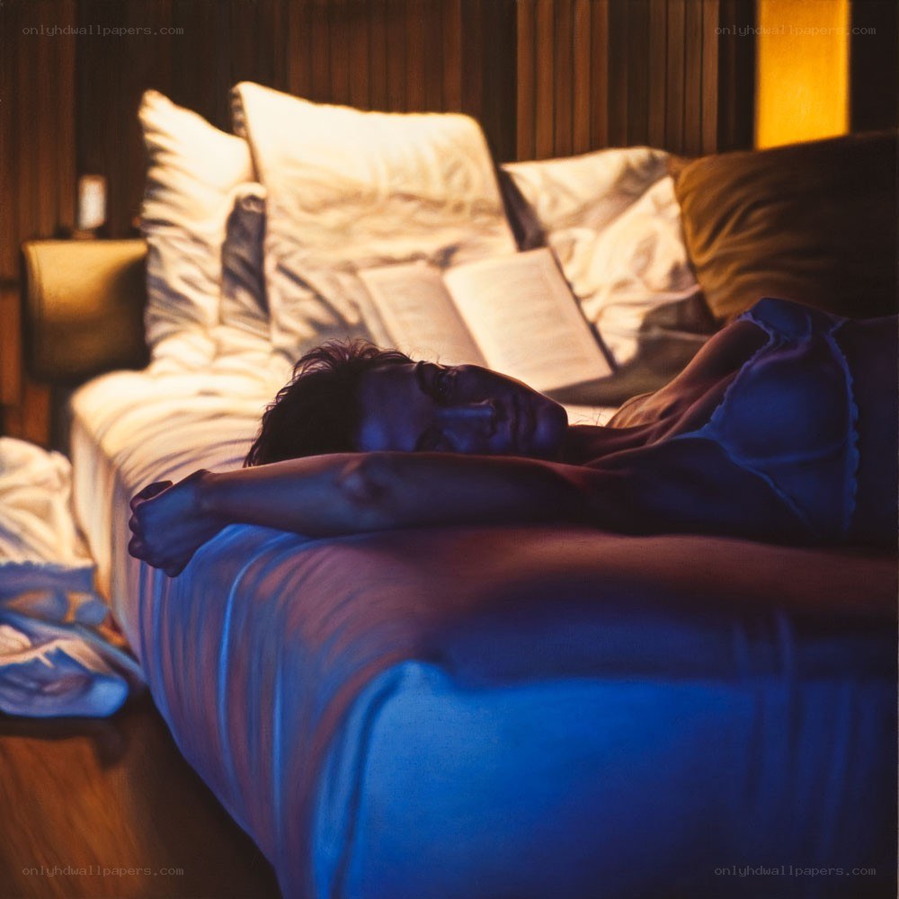 Person resting on a bed