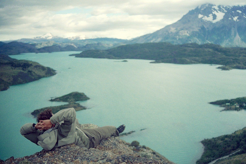 Person resting on a cliff