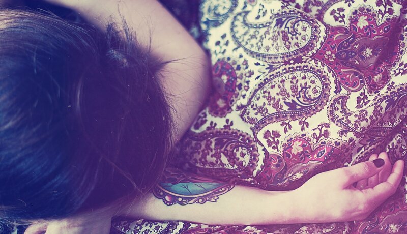 person resting on patterned fabric