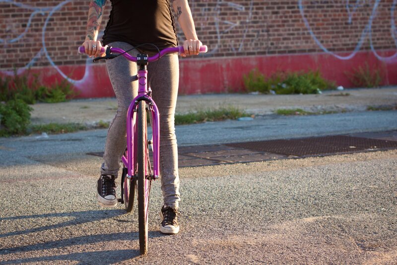 person riding a purple bike