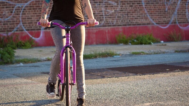 person riding a purple bike