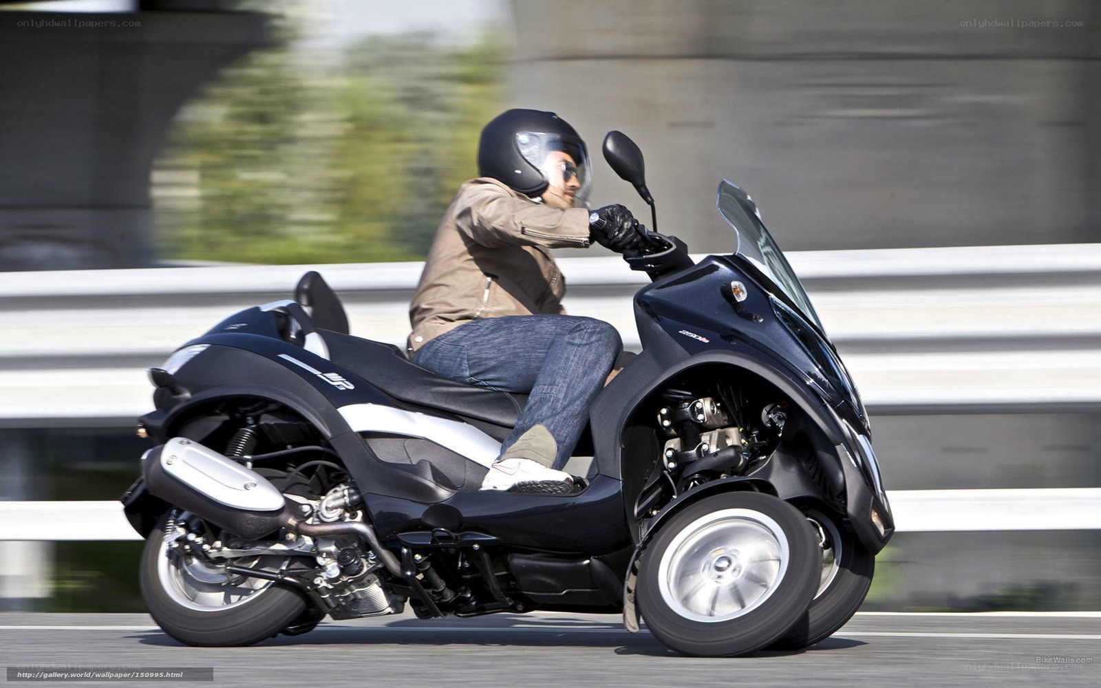 person riding a three-wheeled scooter