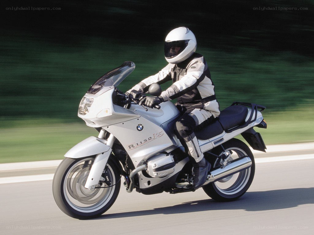 Person riding a white motorcycle