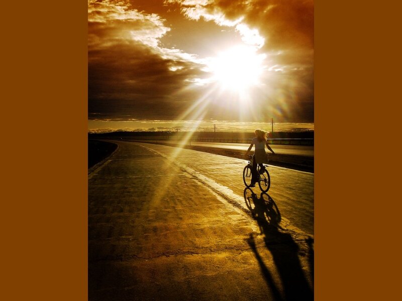Person Riding Bicycle — Gold