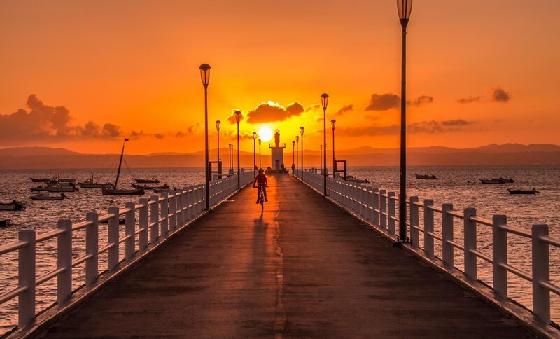 Person Riding Bicycle — Orange, Serene