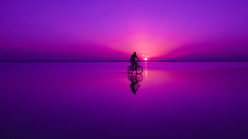 Person Riding Bicycle — Purple, Serene