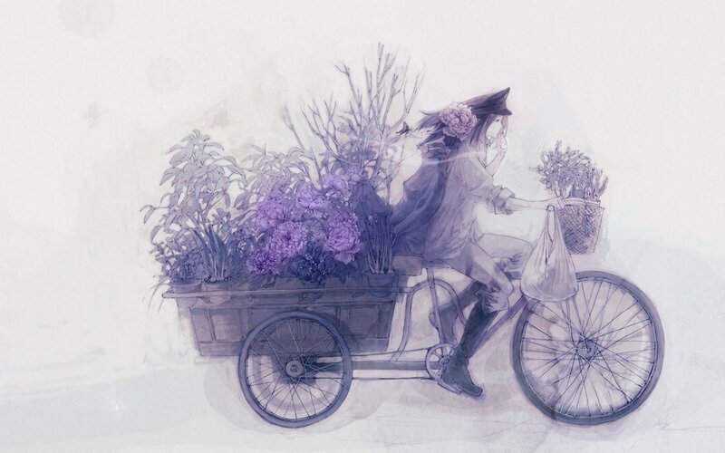 person riding bicycle with flowers