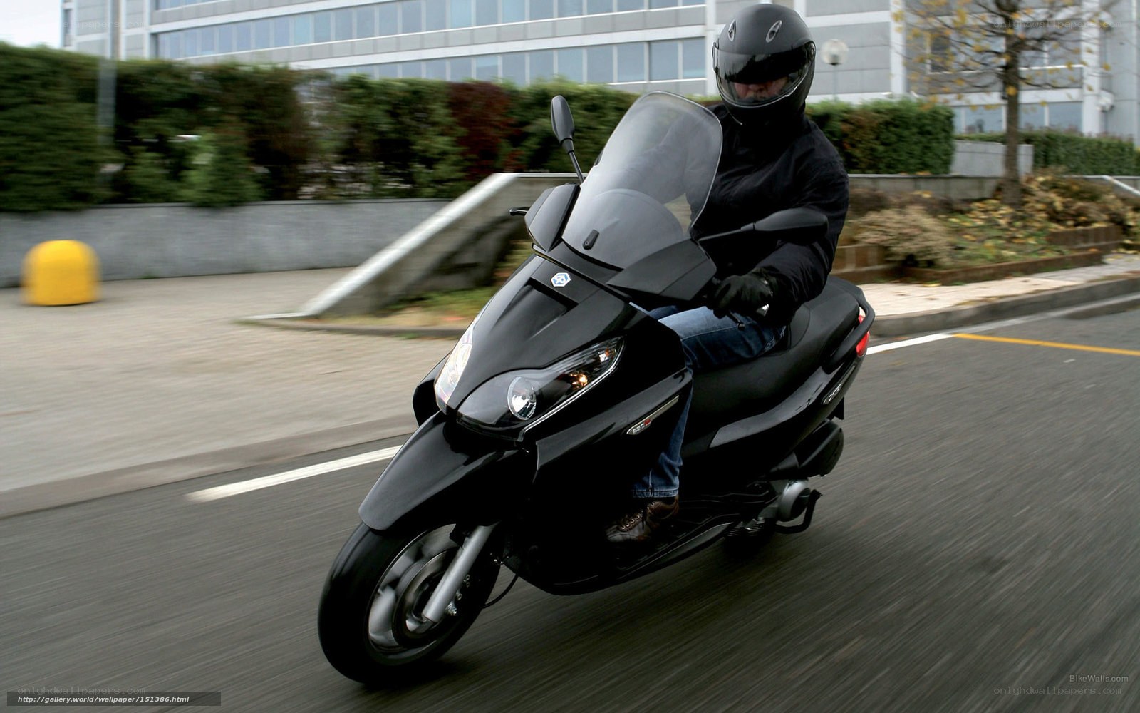person riding black scooter