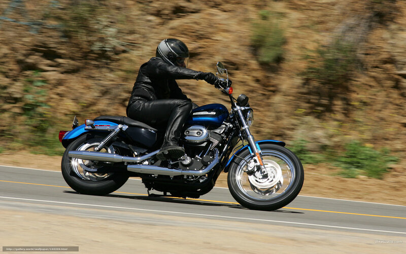 person riding blue motorcycle