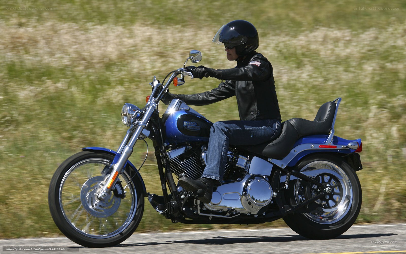 person riding blue motorcycle