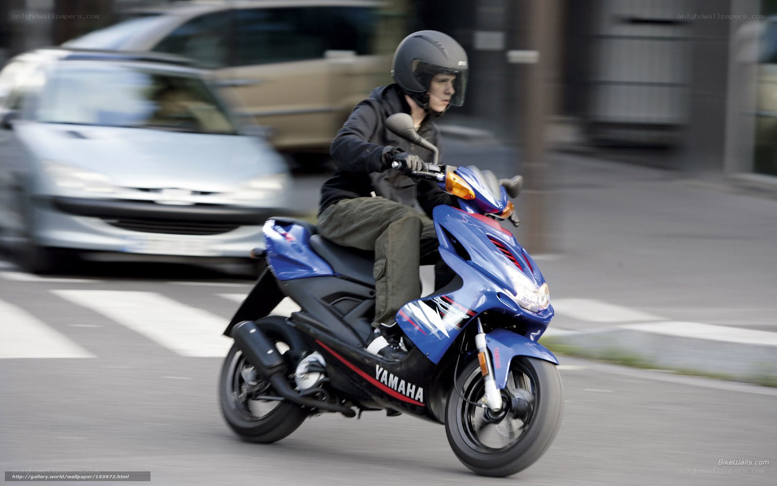 person riding blue scooter