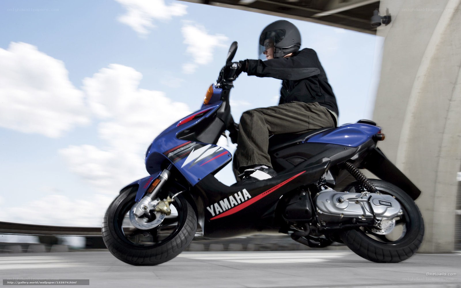 person riding blue scooter