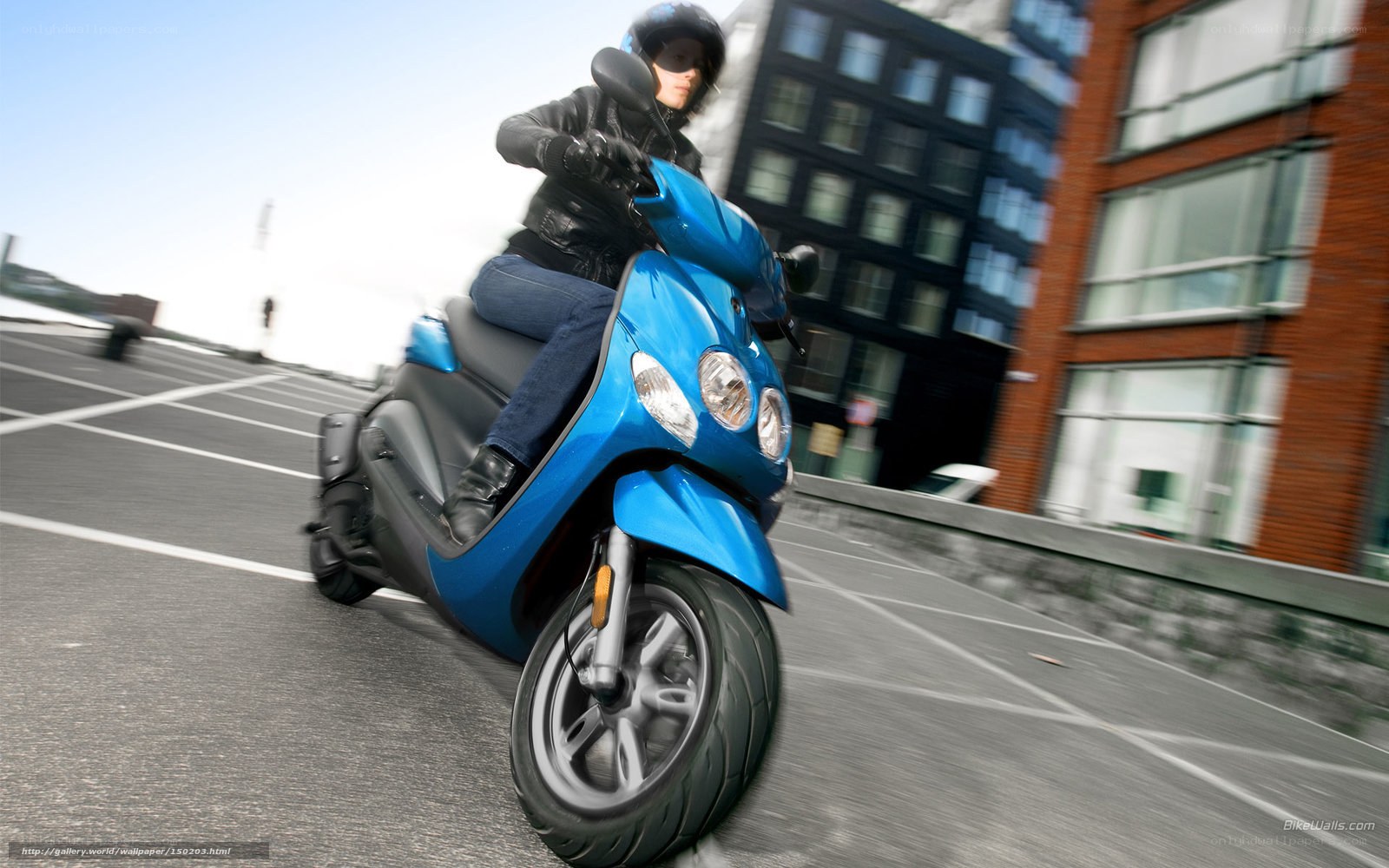 person riding blue scooter