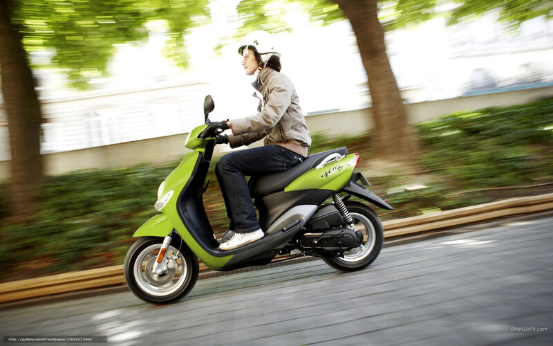 person riding green scooter
