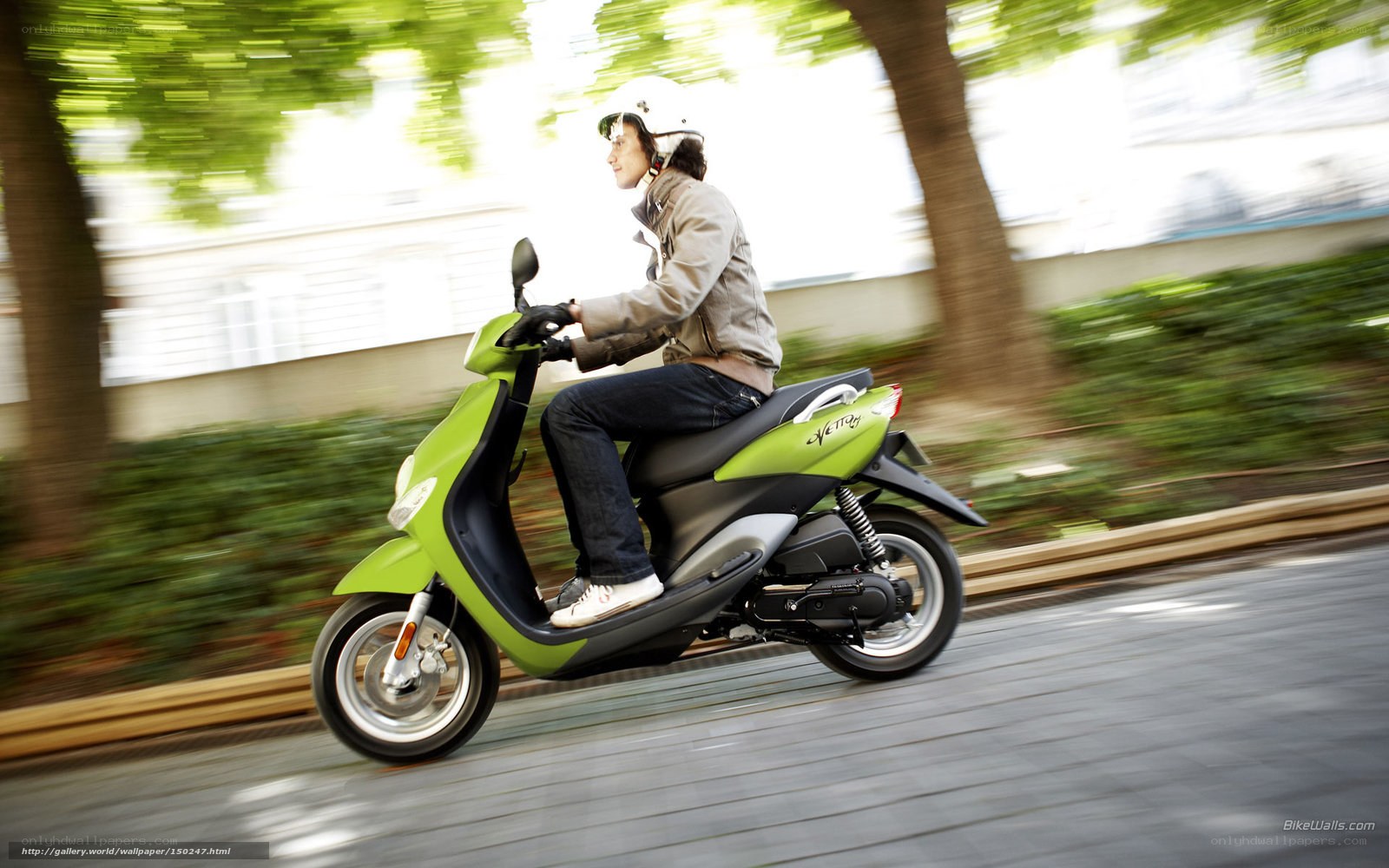person riding green scooter