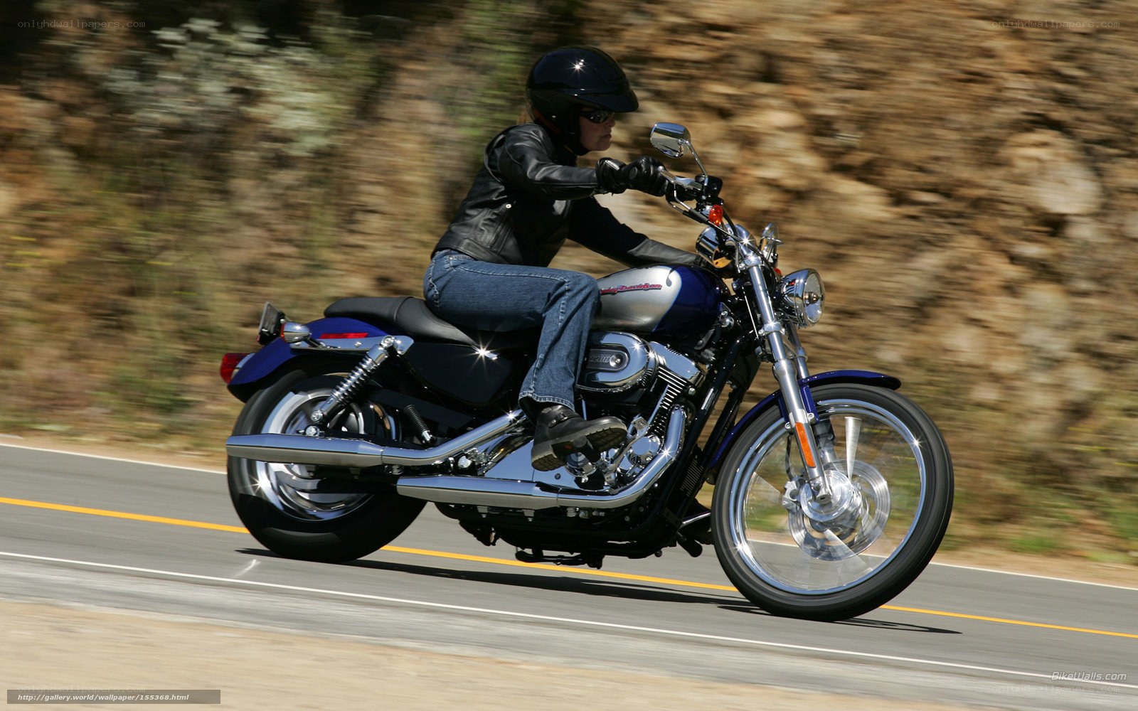 person riding motorcycle on road