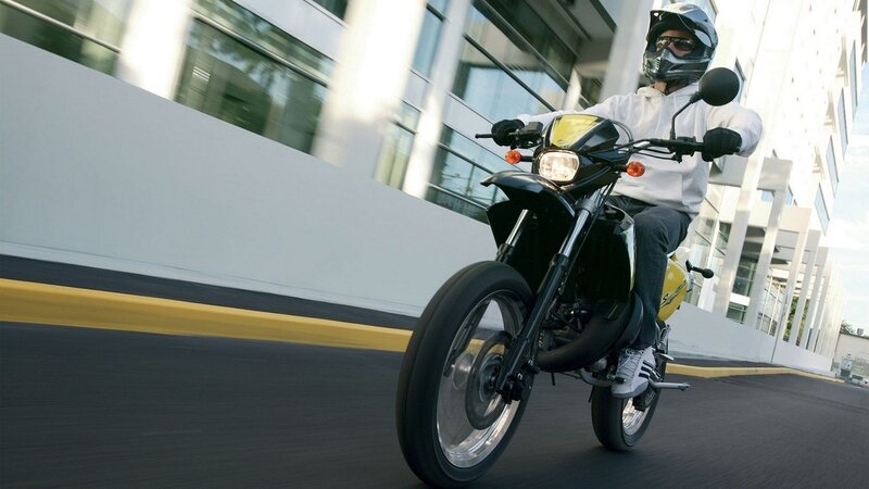 person riding motorcycle on street