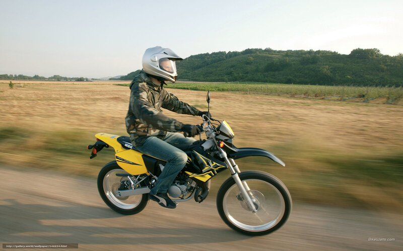 Person Riding Motorcycle — Yellow