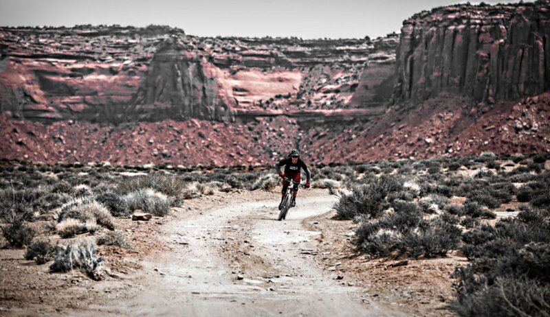 Person Riding Mountain Bike — Red