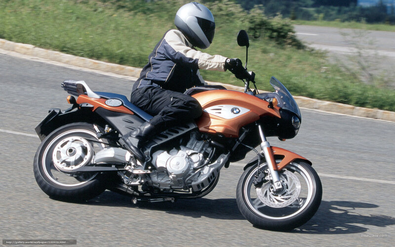 person riding orange motorcycle