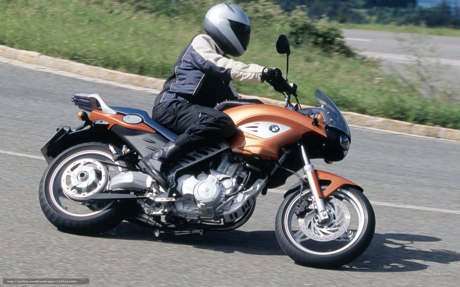 person riding orange motorcycle