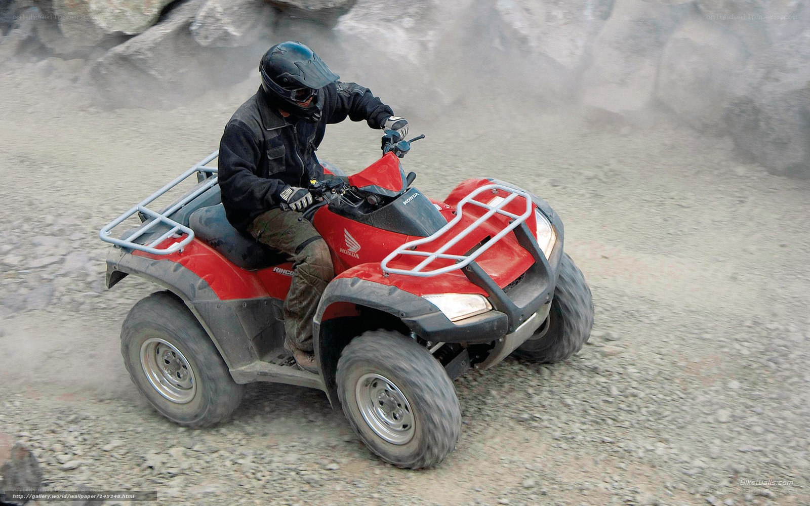 Person riding red ATV