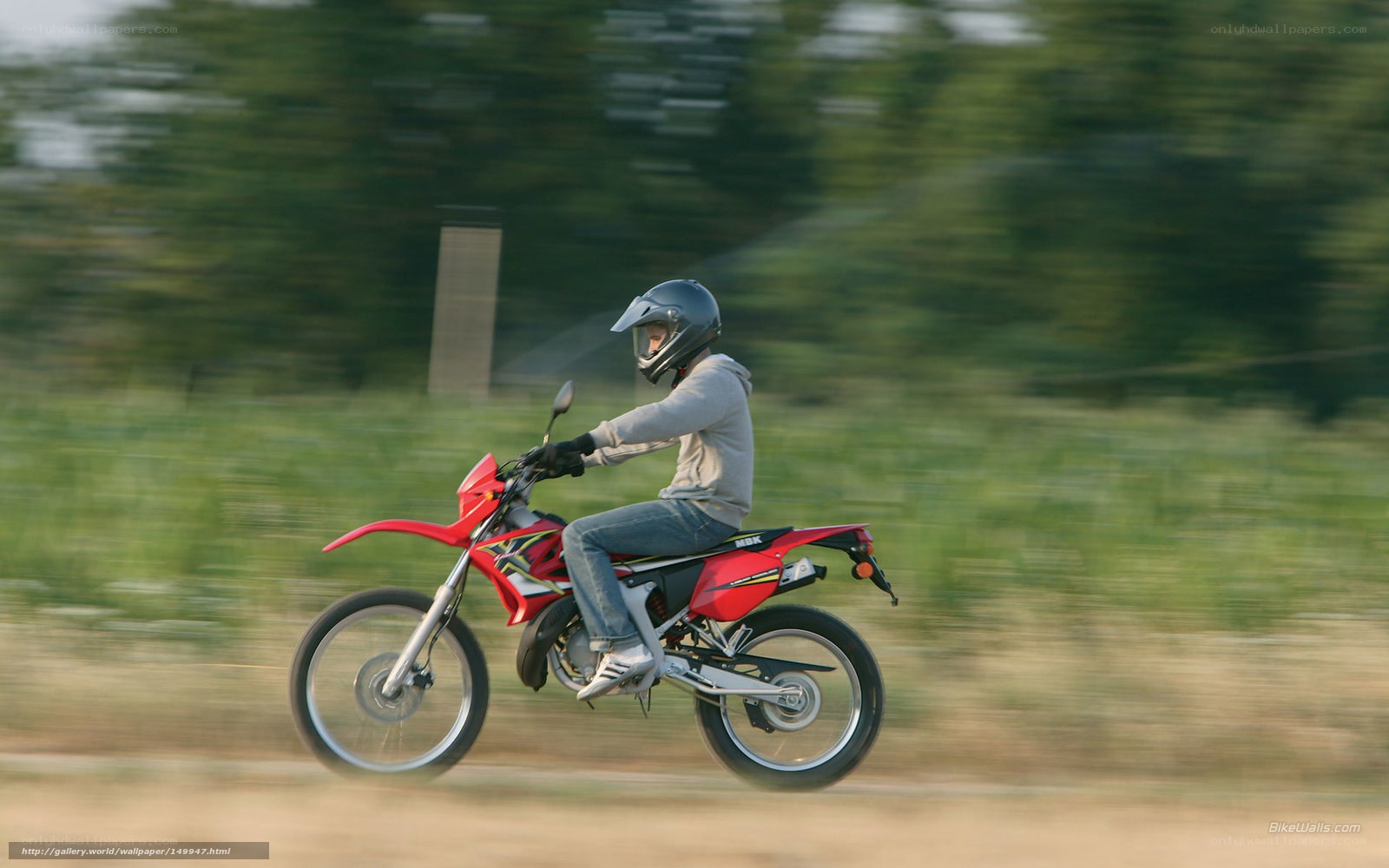 person riding red dirt bike