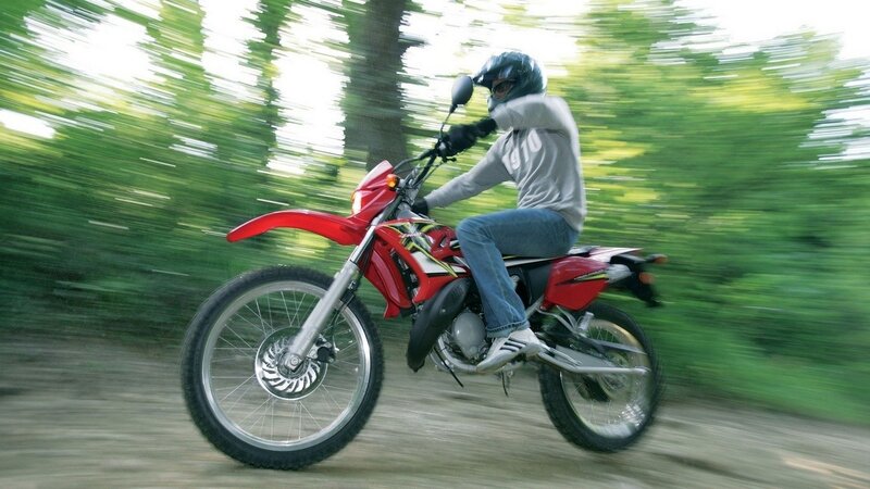 person riding red dirt bike