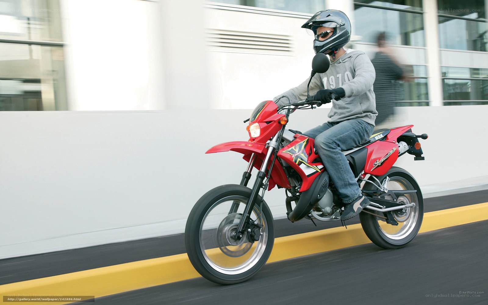 person riding red motorcycle