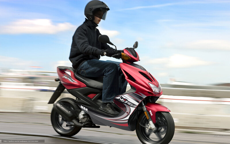 Person riding red scooter