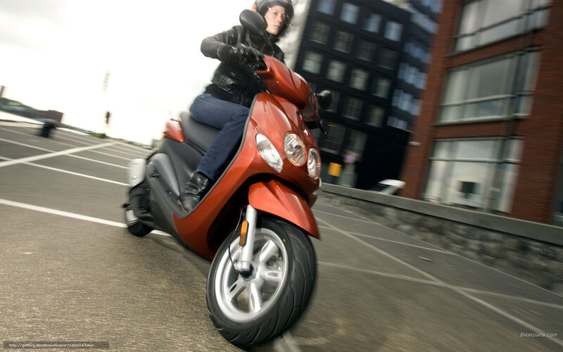Person riding red scooter
