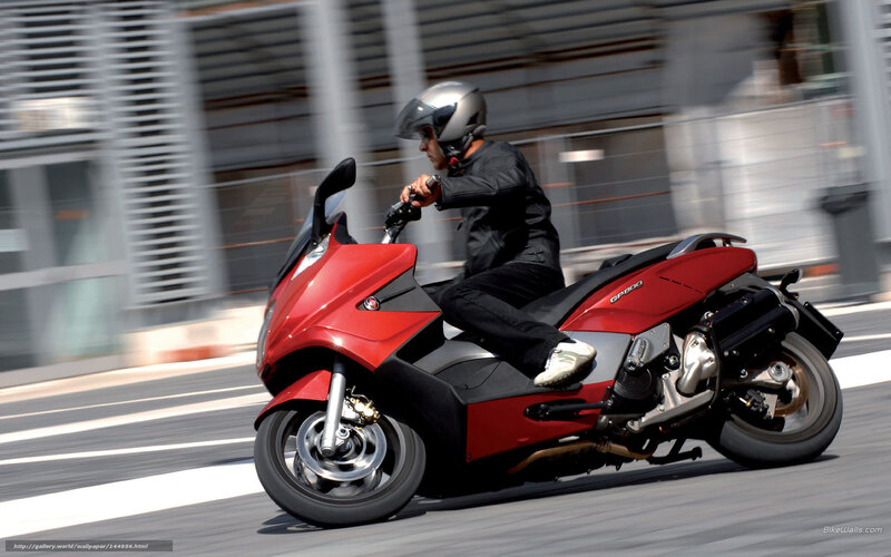 Person Riding Red Scooter — Dynamic, Afternoon, Photograph