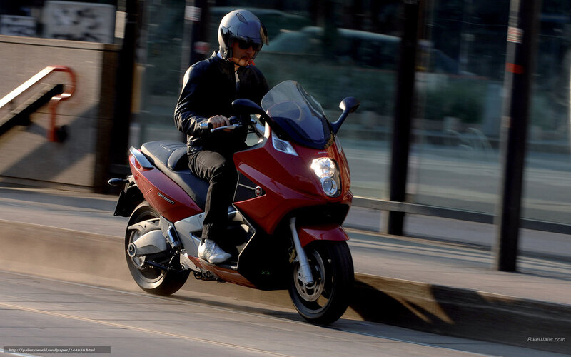 Person Riding Red Scooter — Dynamic