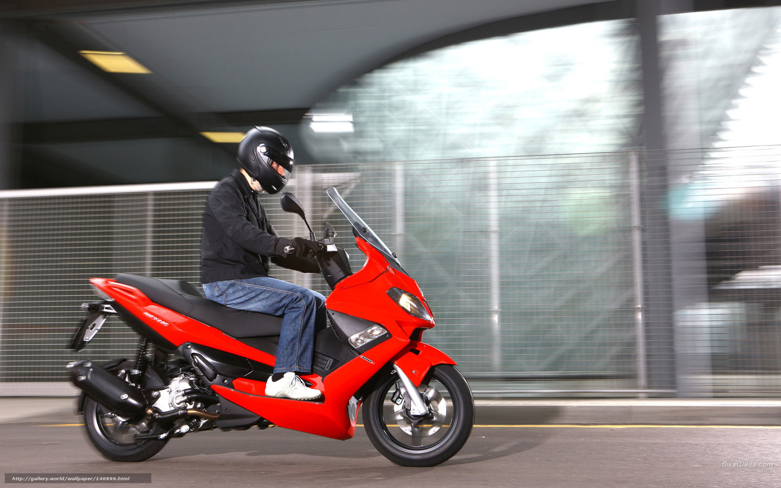 Person riding red scooter