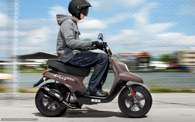 Person Riding Scooter — Brown