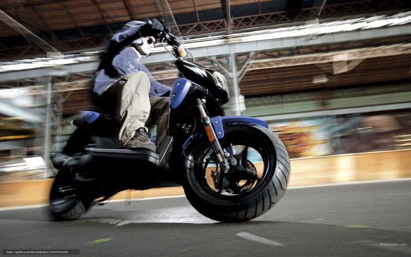 person riding scooter in motion
