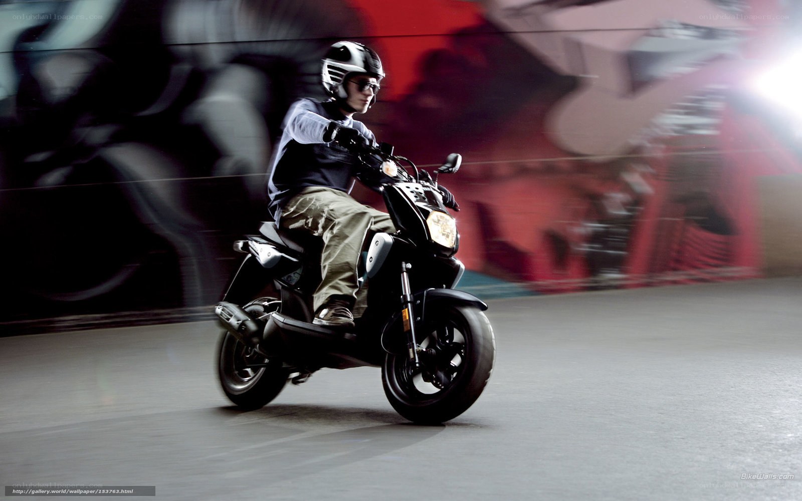 person riding scooter in urban setting