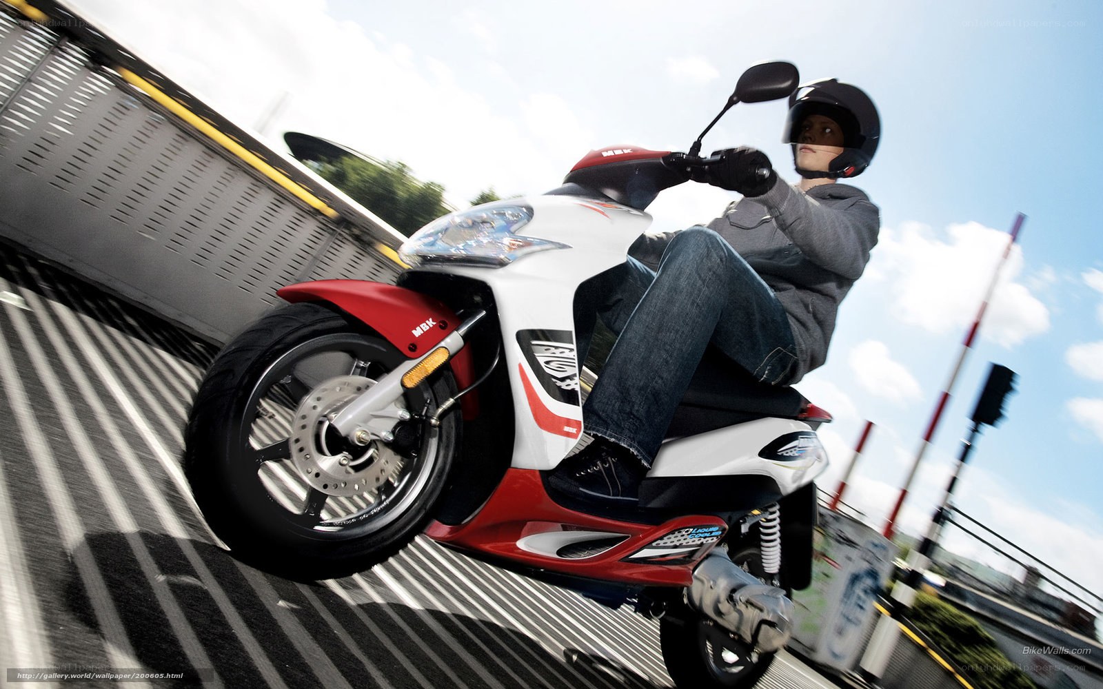 person riding scooter on ramp