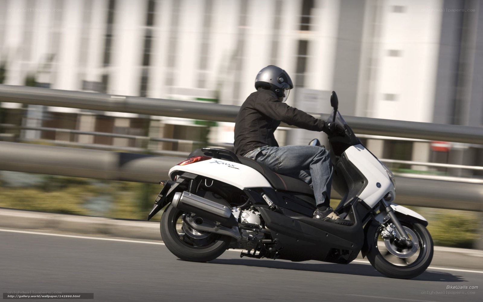 person riding scooter on road