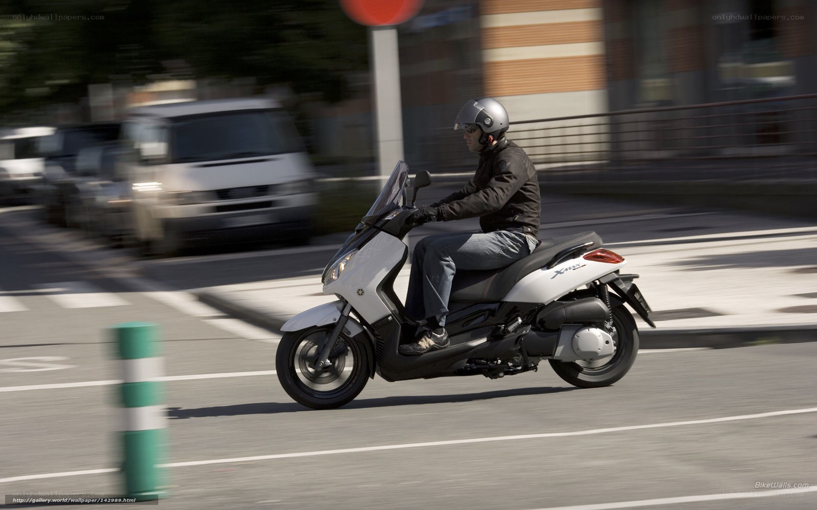 person riding scooter on street