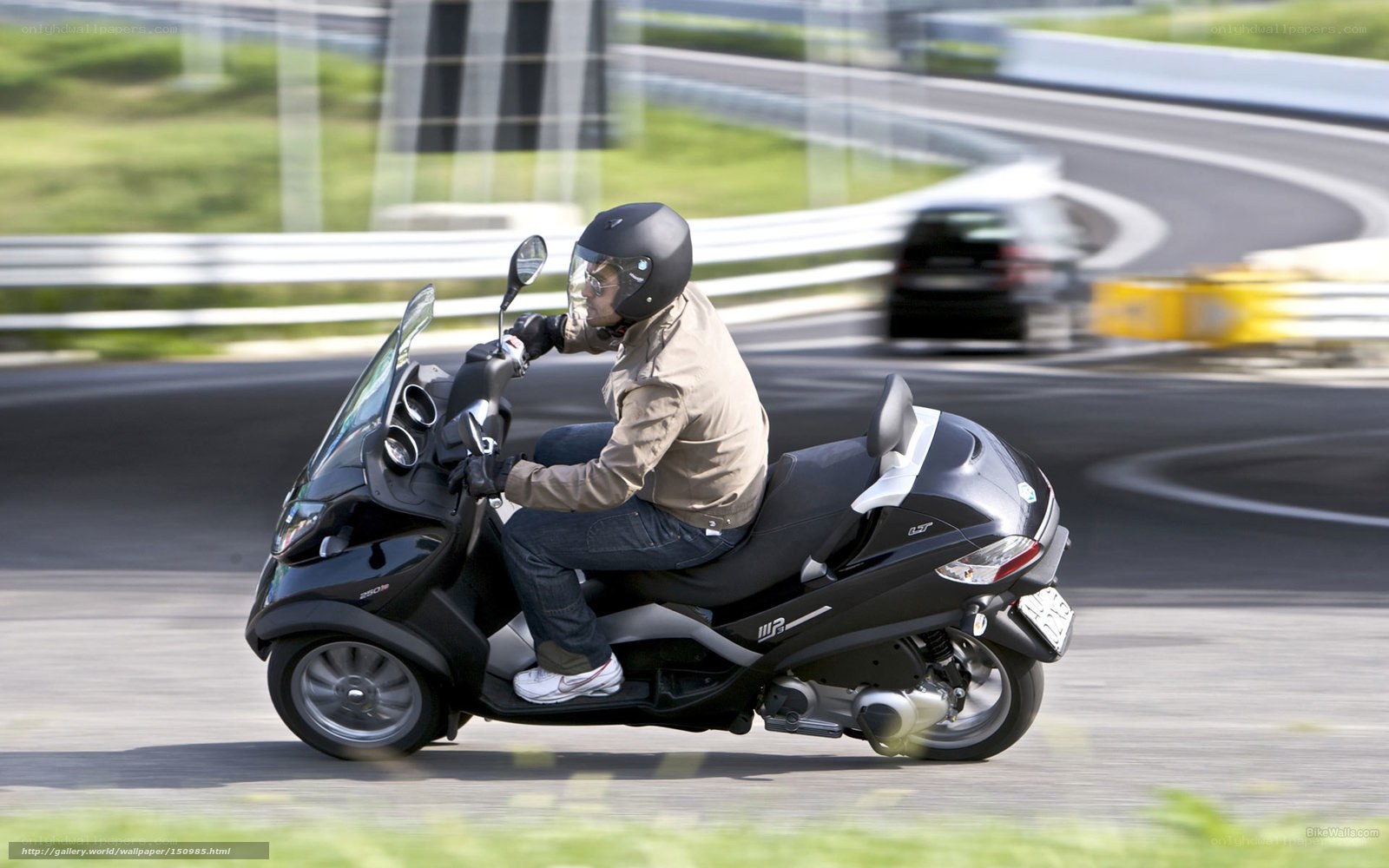 person riding scooter on track