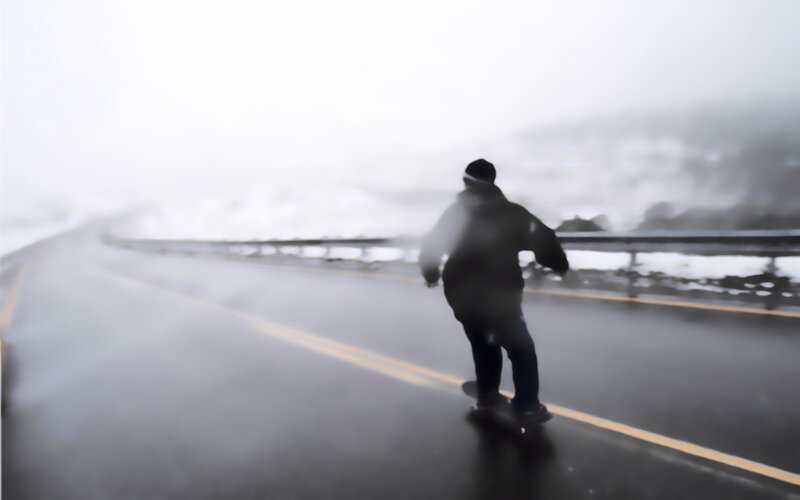 person riding skateboard on road