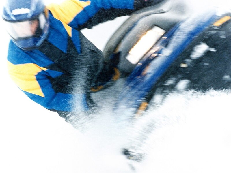 Person riding snowmobile